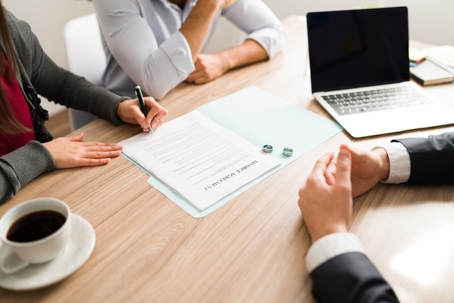 couple signing divorce papers